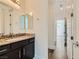 Clean bathroom with granite countertop and dark brown vanity at 284 Crimson Edge St, Henderson, NV 89012