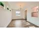 Bright bedroom with wood-look floors and large windows at 284 Crimson Edge St, Henderson, NV 89012