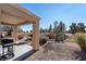 Covered patio with a built-in grill and a view of a golf course at 3109 Frigate Way, North Las Vegas, NV 89084