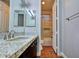 Bathroom with granite countertop, dark wood vanity, and tiled shower at 316 Pleasant Summit Dr, Henderson, NV 89012