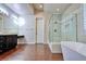Primary bathroom with double sinks, walk-in shower, and free-standing tub at 316 Pleasant Summit Dr, Henderson, NV 89012