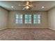 Primary bedroom with three windows and ceiling fan at 316 Pleasant Summit Dr, Henderson, NV 89012
