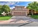 Two-story house with a two-car garage and landscaped lawn at 316 Pleasant Summit Dr, Henderson, NV 89012