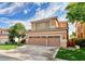 Beautiful two-story home with a three-car garage and landscaped yard at 316 Pleasant Summit Dr, Henderson, NV 89012