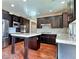 Modern kitchen with dark cabinets, granite counters and island at 316 Pleasant Summit Dr, Henderson, NV 89012