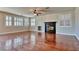 Living room with hardwood floors, fireplace, and ceiling fan at 316 Pleasant Summit Dr, Henderson, NV 89012