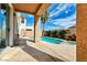 Covered patio overlooking the sparkling pool and spa at 316 Pleasant Summit Dr, Henderson, NV 89012