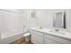 Bright bathroom features a double sink vanity with modern fixtures and a shower-tub combo at 334 Taylor St, Henderson, NV 89015