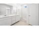 Modern bathroom with a double sink vanity and a glass-enclosed shower at 334 Taylor St, Henderson, NV 89015