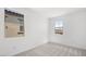 Bright bedroom featuring plush neutral carpet, abundant natural light and a spacious closet at 334 Taylor St, Henderson, NV 89015