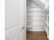 A large walk-in closet features ample shelving and wood floors, offering plenty of storage space at 334 Taylor St, Henderson, NV 89015