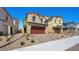 Home exterior with a red two car garage and ample driveway space at 334 Taylor St, Henderson, NV 89015