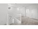 Upstairs hallway with natural light, neutral carpet, and access to multiple rooms at 334 Taylor St, Henderson, NV 89015