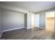 Well-lit bedroom, wood-look floors, and ample closet space at 4348 Tara Ave # 2, Las Vegas, NV 89102