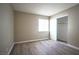 Bedroom with wood-look floors, closet and window at 4348 Tara Ave # 2, Las Vegas, NV 89102