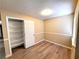 Bedroom with wood-look floors, closet, and built-in shelving at 4348 Tara Ave # 2, Las Vegas, NV 89102