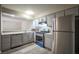 Modern kitchen with stainless steel appliances and wood-look flooring at 4348 Tara Ave # 2, Las Vegas, NV 89102