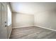 Bright living room with wood-look floors and large window at 4348 Tara Ave # 2, Las Vegas, NV 89102