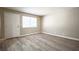 Bright living room with wood-look floors and large window at 4348 Tara Ave # 2, Las Vegas, NV 89102