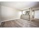Spacious living room with wood-look floors and kitchen views at 4348 Tara Ave # 2, Las Vegas, NV 89102