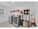 Laundry room with two washers and shelves at 6052 Beavertail Hill Ave, Las Vegas, NV 89130