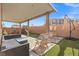 Covered patio, grassy area, playground, and seating at 6301 Beavertail Pond Ave, Las Vegas, NV 89122