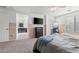 Main bedroom with ensuite bathroom access and TV at 6301 Beavertail Pond Ave, Las Vegas, NV 89122