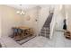 Dining area with wooden table and staircase view at 6301 Beavertail Pond Ave, Las Vegas, NV 89122