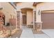 Inviting front porch with stone accents and seating area at 6301 Beavertail Pond Ave, Las Vegas, NV 89122