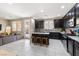 Open concept kitchen with island and stainless steel appliances at 6301 Beavertail Pond Ave, Las Vegas, NV 89122