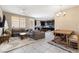 Open concept living and dining area with hardwood floors at 6301 Beavertail Pond Ave, Las Vegas, NV 89122