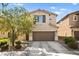 Two-story house with brown garage door and landscaping at 6389 Jacobville Ct, Las Vegas, NV 89122