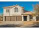 Two-story house with brown double garage doors and a tile roof at 6436 Heatherton Ave, Las Vegas, NV 89110