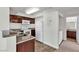 Modern kitchen featuring granite countertops, wood cabinets, and white appliances at 6800 E Lake Mead Blvd # 2028, Las Vegas, NV 89156