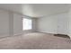 Spacious living area with carpet and a large window, offering ample natural light at 6800 E Lake Mead Blvd # 2028, Las Vegas, NV 89156