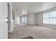 Spacious living room with carpet flooring and access to a balcony at 6800 E Lake Mead Blvd # 2028, Las Vegas, NV 89156