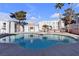 Relaxing kidney-shaped community pool with adjacent building at 6800 E Lake Mead Blvd # 2028, Las Vegas, NV 89156
