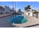 Community pool with surrounding patio and building views at 6800 E Lake Mead Blvd # 2028, Las Vegas, NV 89156