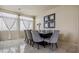 Formal dining room with gray chairs and a large table at 6861 Philharmonic Ave, Las Vegas, NV 89139