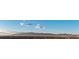 Expansive city view of the community with mountains in the background under a blue sky at 700 W Carson Ave # 1401, Las Vegas, NV 89106