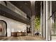 Modern lobby with high ceilings, a large tree, and stylish seating at 700 W Carson Ave # 1401, Las Vegas, NV 89106
