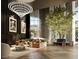 Upscale lobby with stylish furniture, a large tree, and a grand chandelier at 700 W Carson Ave # 1401, Las Vegas, NV 89106
