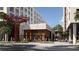 Modern retail building with outdoor seating and sculpture at 700 W Carson Ave # 1401, Las Vegas, NV 89106