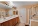 Bathroom with double sinks, shower, and separate tub at 848 Percy Arms St, Las Vegas, NV 89138