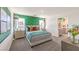 Spacious bedroom with a green accent wall and en suite bathroom at 10004 Ullom Dr # Lot 17, Las Vegas, NV 89141