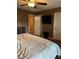 Main bedroom with large bed and mounted TV at 1021 Amber Gate St, Henderson, NV 89002