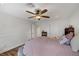 Well-lit bedroom with a ceiling fan and ample closet space at 105 Quail Run Rd, Henderson, NV 89014