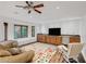 Bright game room featuring wood flooring, built-in cabinets, and a window seat at 105 Quail Run Rd, Henderson, NV 89014