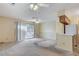 Living room features carpet, ceiling fan, sliding door to patio at 1665 Rowan Tree Dr, Las Vegas, NV 89123