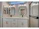 Double vanity bathroom with white cabinets, quartz countertops, and black accents at 1894 Wallingford St, Henderson, NV 89052